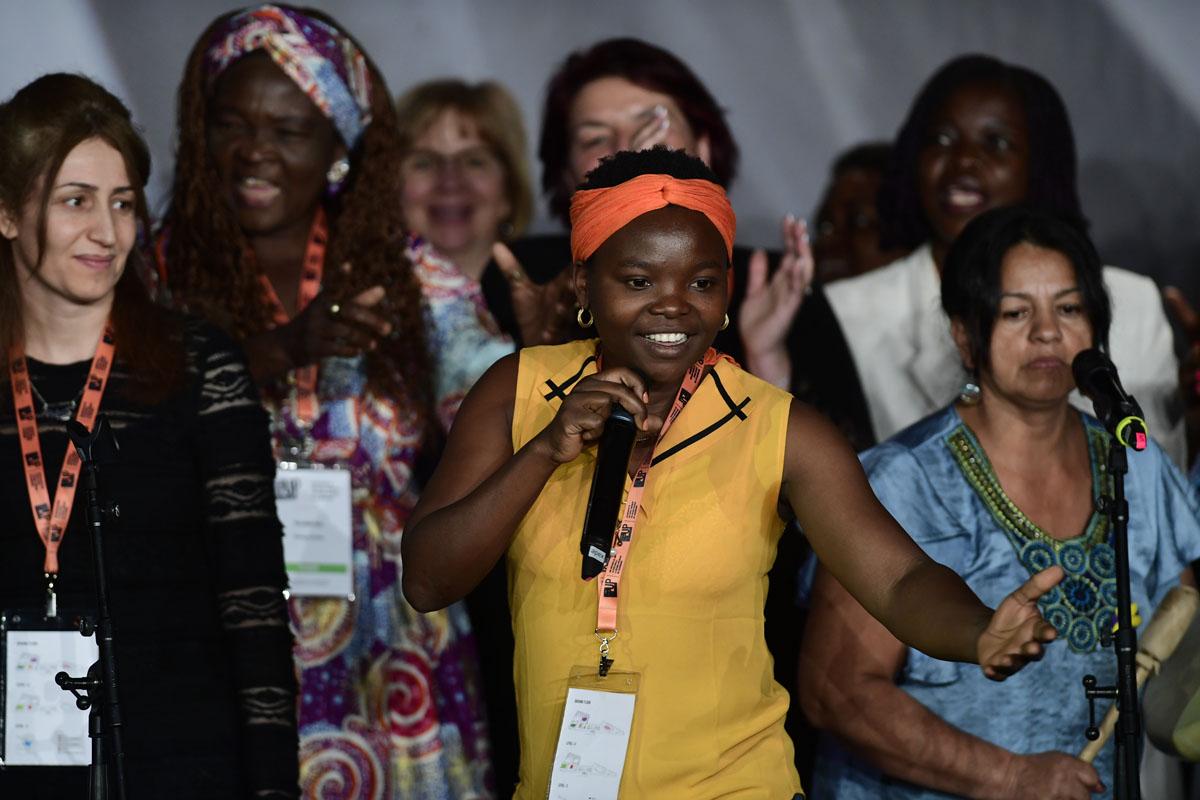 Survivors on stage at the International Forum "Stand Speak Rise Up!