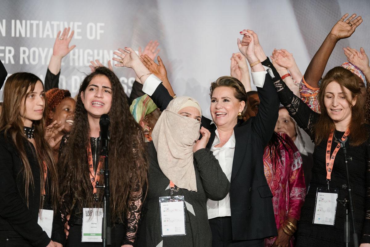 The Grand Duchess and the survivors celebrate on stage the last day of the International Forum "Stand Speak Rise Up!