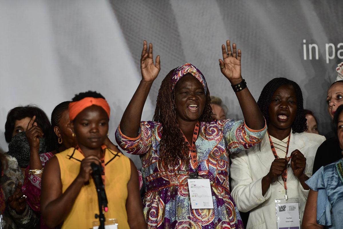 Survivors on stage at the International Forum "Stand Speak Rise Up!