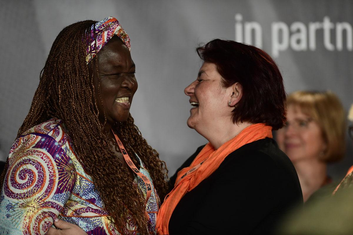 Survivors on stage at the International Forum "Stand Speak Rise Up!