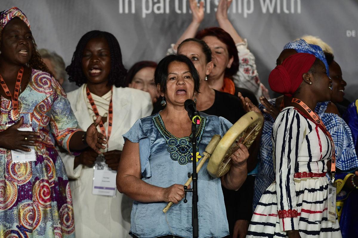 Survivors on stage at the International Forum "Stand Speak Rise Up!