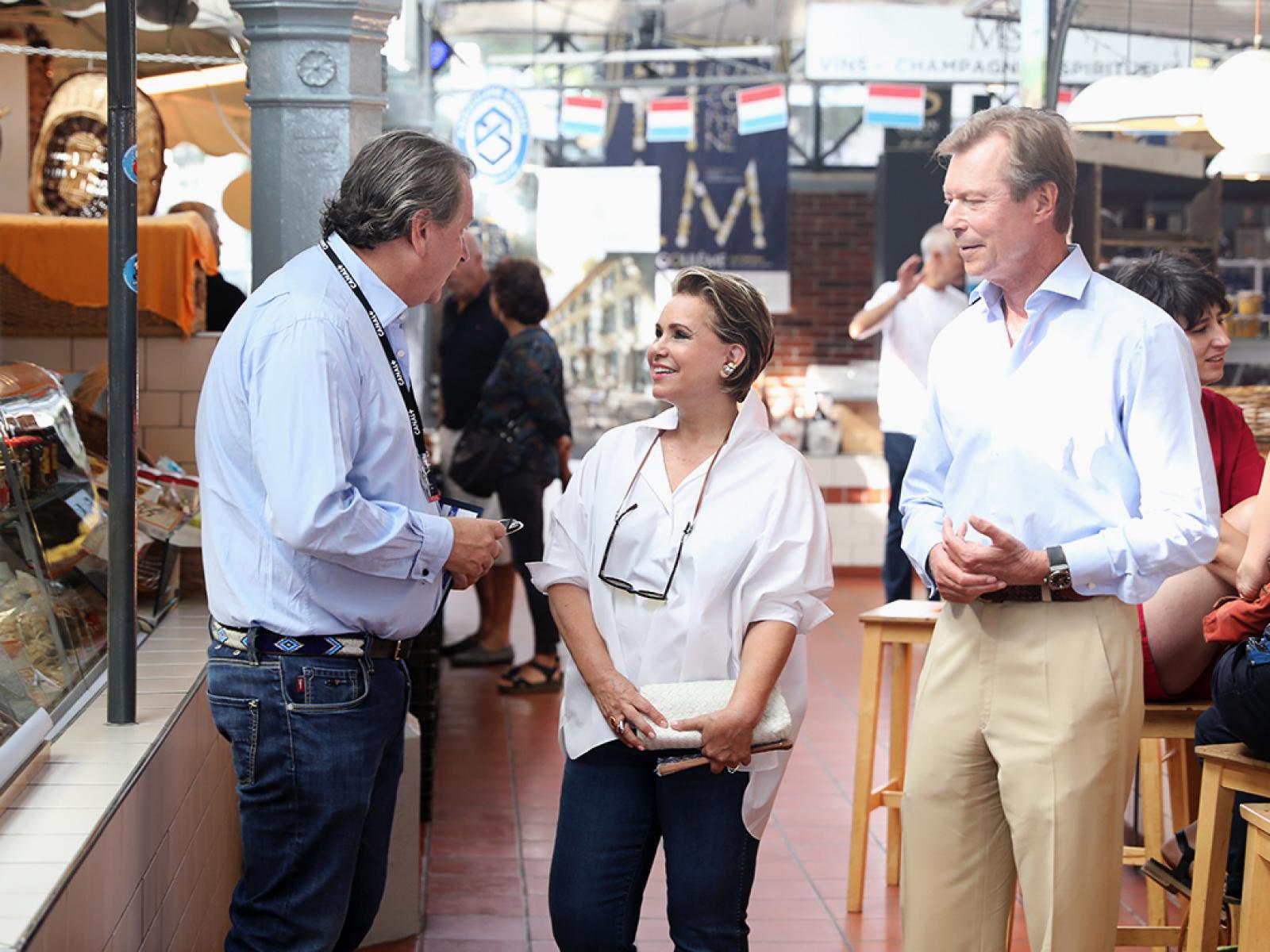 The Grand Ducal Couple talking to a man at the market