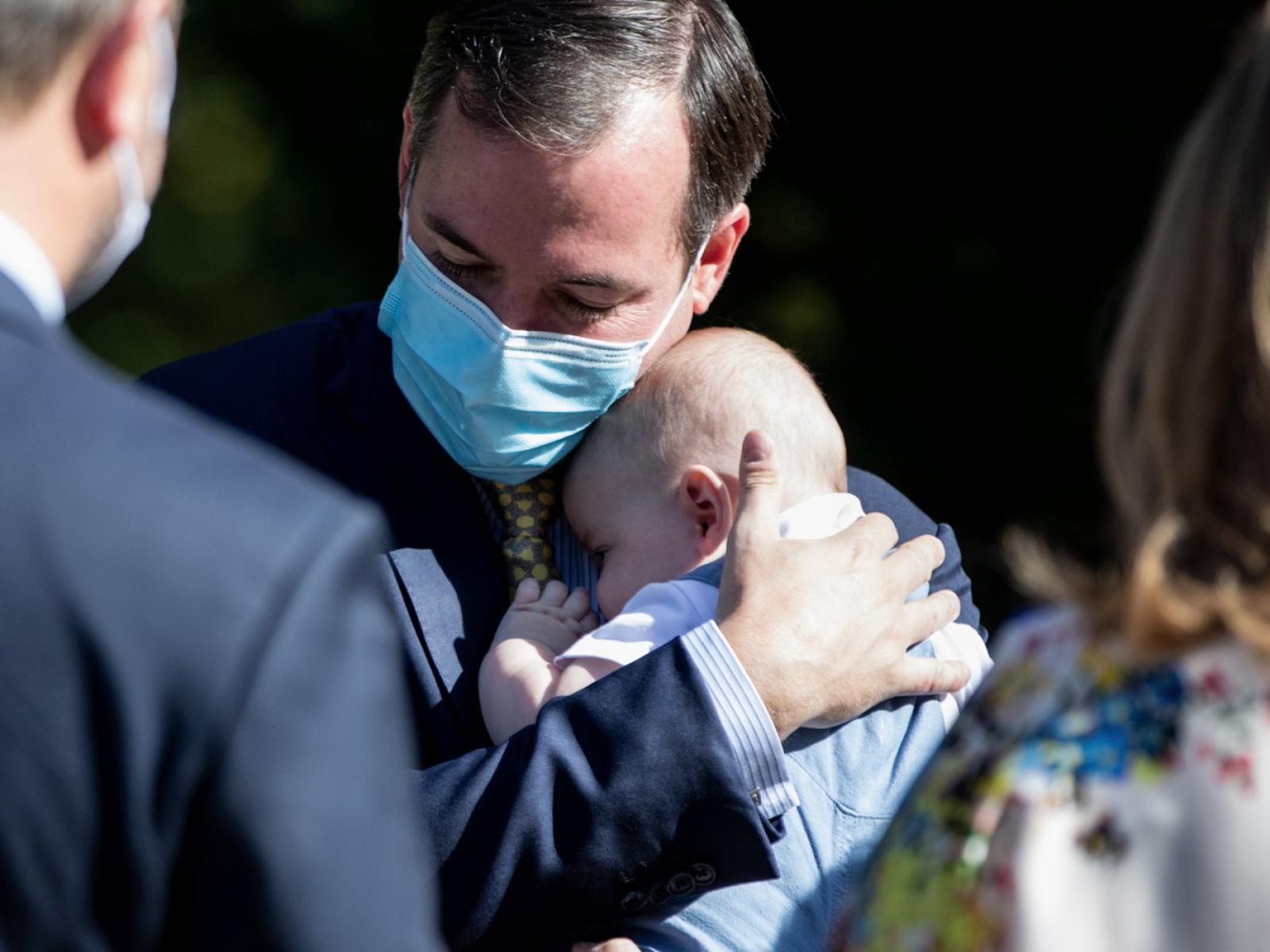 Prince Guillaume holding Prince Charles