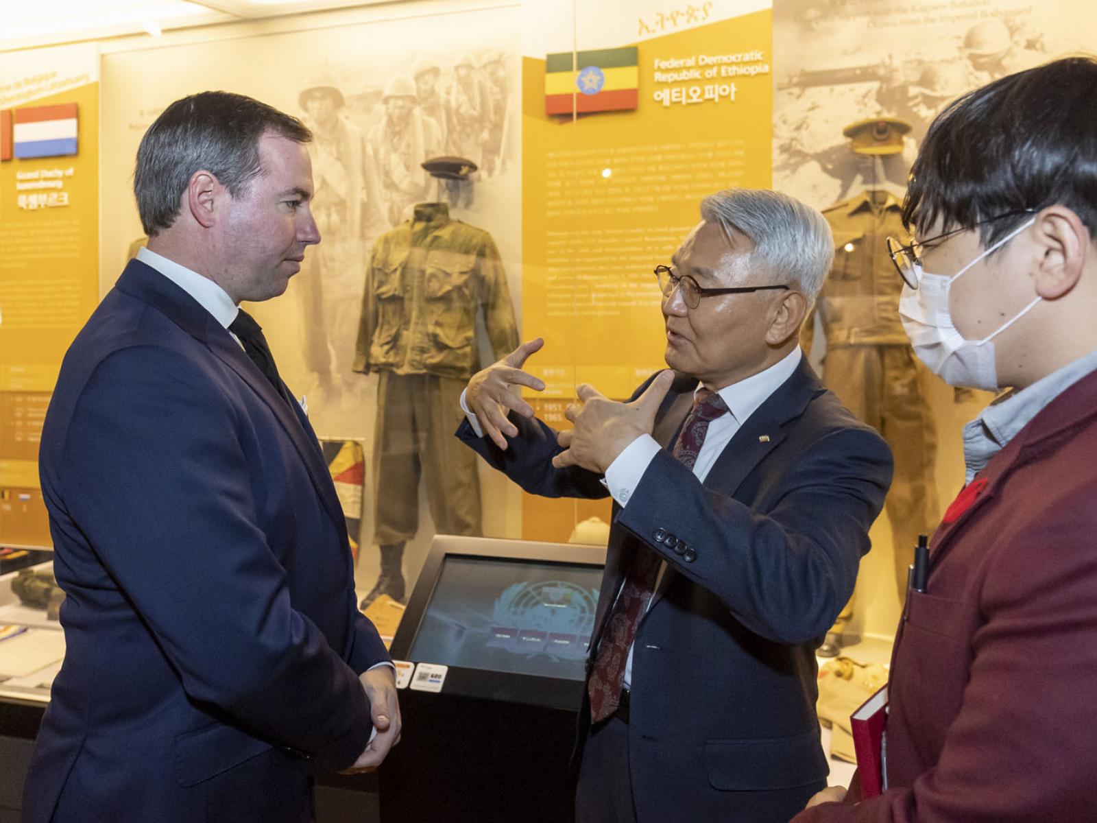 The Prince is discussing with the Director of the Memorial