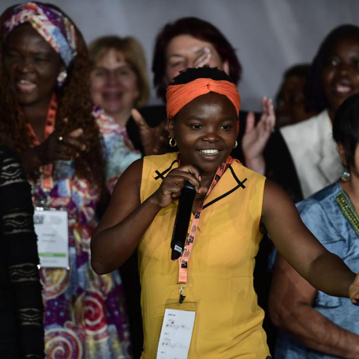 Survivors on stage at the International Forum "Stand Speak Rise Up!