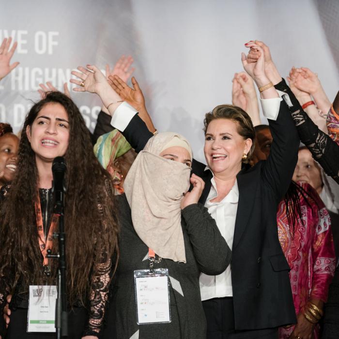 The Grand Duchess and the survivors celebrate on stage the last day of the International Forum "Stand Speak Rise Up!