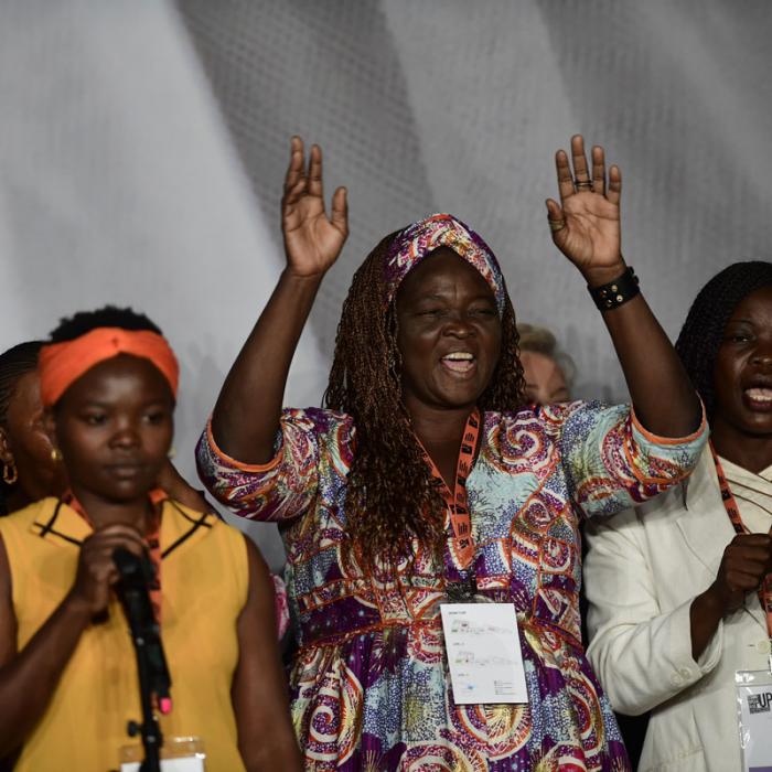 Survivors on stage at the International Forum "Stand Speak Rise Up!