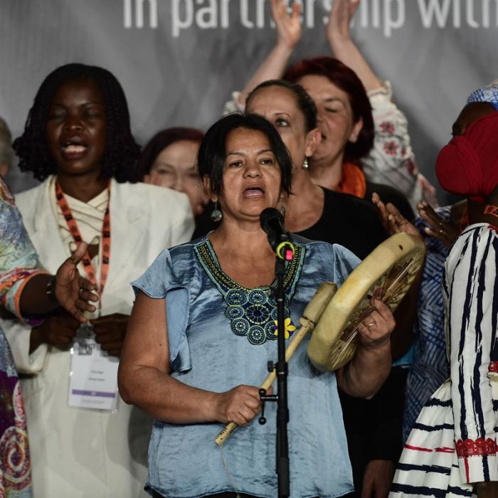 Survivors on stage at the International Forum "Stand Speak Rise Up!